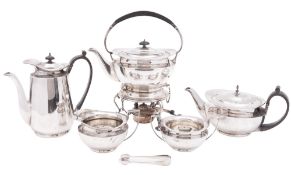 An Edwardian five-piece silver tea & coffee set, of circular form, with cape rims,