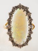 An opal and diamond cluster ring, of elongated oval form,