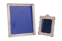 A modern silver mounted photograph frame, rounded rectangular form,