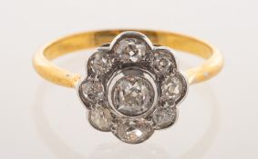 A diamond daisy ring, collet and grain set with old-cut diamonds, diamonds approx. 0.
