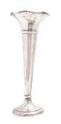 A George V silver vase, tapering circular form and with a flaring rim, loaded base, (A/F),