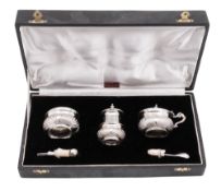 A 20th century Indian silver three-piece condiment set, oval form,