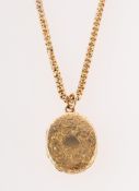 A Victorian locket and chain, an ornate floral and foliate carved oval locket, length approx. 2.