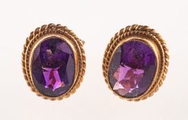 A pair of 9ct gold amethyst stud earrings, each earring of oval form,