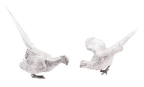 A pair of late 19th/ early 20th century German novelty silver peppers,