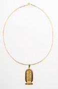 An Egyptian hieroglyph pendant with bi-colour wire necklet,