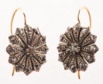 A pair of Victorian diamond and paste stone flower head earrings,