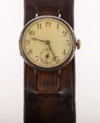 A 1920's Swiss pilot's watch, the round dial having black Arabic hour numerals,