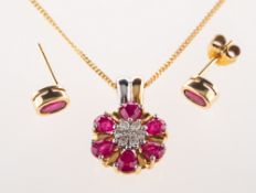 An 18ct ruby and diamond pendant with chain and a pair of ruby earrings,