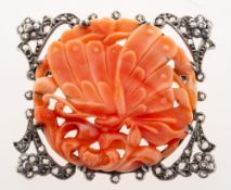 A Victorian carved coral plaque in a rose-cut diamond brooch mount,