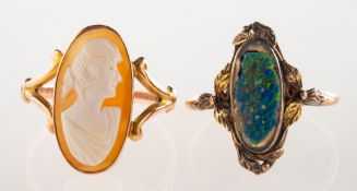 Two dress rings, including a ring set with an elongated oval camel, openwork 'v' split shoulders,