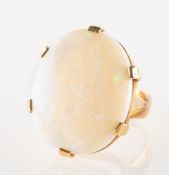 An opal cocktail ring, claw set with a large oval opal cabochon, measuring approx. 24.0mm x 20.