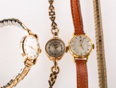 Three wristwatches to include Longines a lady's 9K gold wristwatch the dial having raised diamond