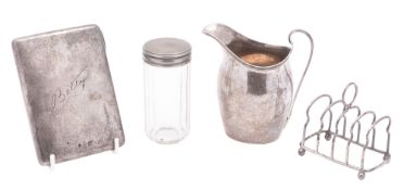 A small mixed lot of silver, to include a glass mounted jar, a milk jug,