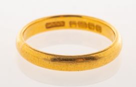 A 22ct gold wedding band, UK hallmark, size K, 3.4grams.