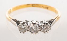 A three stone diamond ring, claw set with three older brilliant-cut diamonds, diamonds approx. 0.