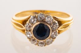 An antique sapphire and diamond cluster ring with stick pin fitting,