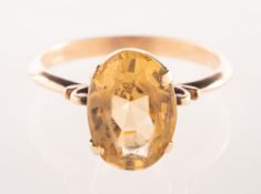 A citrine dress ring, claw set with an oval-cut citrine, unmarked, size P to P1/2, 3.7grams.