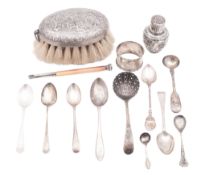 A mixed lot of silver, to include a Dutch mounted brush, a vase-shaped caster,
