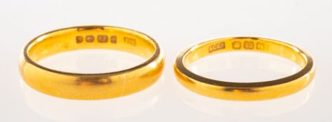 Two 22ct gold wedding bands, both UK hallmark, sizes O1/2 and N1/2, total gross weight 10.5grams.