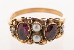 A Georgian/early Victorian garnet, pearl and diamond ring, set to the centre with two split pearls,