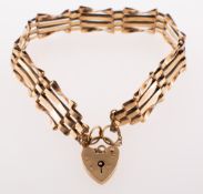 A gate bracelet with heart padlock and safety chain, heart padlock with UK hallmark 375,