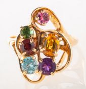 A multi-colour gemstone dress ring, an openwork abstract design ring,