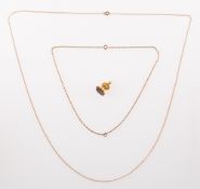 Two chains and a fob seal, a twisted rose coloured rope style chain, marked 9ct to bolt ring,