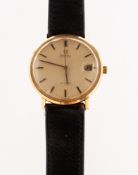 Omega De Ville a 9K gold wristwatch the brushed gold dial having raised baton numerals,