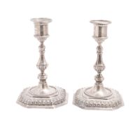 A pair of Victorian silver candlesticks, on octagonal bases, with gadrooned borders,