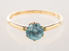 A 14ct gold blue zircon ring, six claw set with a blue zircon, measuring approx. 5.