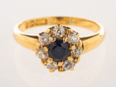 A late Victorian 18ct gold sapphire and diamond cluster ring,