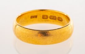 A 22ct gold wedding band, UK hallmark, size P to P1/2, 7.7grams.