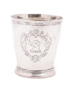 A George II silver beaker, tapering circular form and crested within a rococo cartouche, marks worn,
