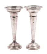 A pair of George V silver vases, tapering circular form,