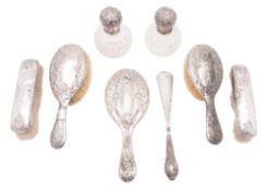 Silver dressing table items, to include 2 mounted clear cut-glass scent bottles, 2 hair brushes,