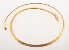 A vintage tri-colour necklace, of brick links with a textured finish, polished finish to verso,