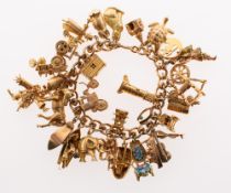 A charm bracelet with charms, the curb link bracelet, marked 9ct to bolt ring, 9 .