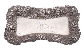 A late 19th/ early 20th century North American silver pin tray, shaped rectangular outline,