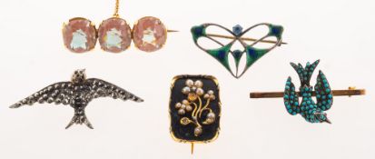 A collection of five antique brooches,