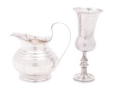 A late Victorian silver milk jug, of squat circular form,