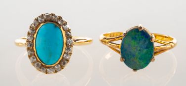 Two antique rings, including a cluster ring, collet set with an oval turquoise cabochon,