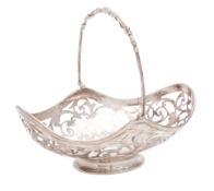 A Victorian silver swing-handled bonbon dish, shaped oval outline,