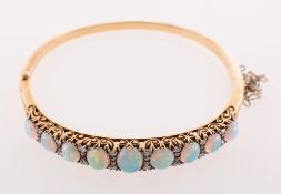 A Victorian opal and diamond hinged bangle,