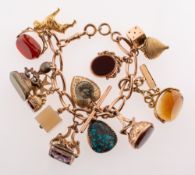 A charm bracelet with charms, the bracelet of twisted links and swivel clasp,