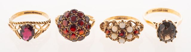A group of four 9ct gold gem-set dress rings, including a 9ct gold bombé style ring,