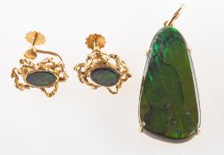 An ammolite pendant and a pair of ammolite earrings,