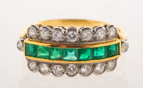 A 1980's 18ct gold emerald and diamond ring, a three row ring,