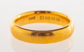 A 22ct gold wedding band, UK hallmark, size K, 6.0grams.