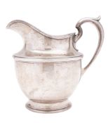 A 20th century North American silver pitcher, circular form,